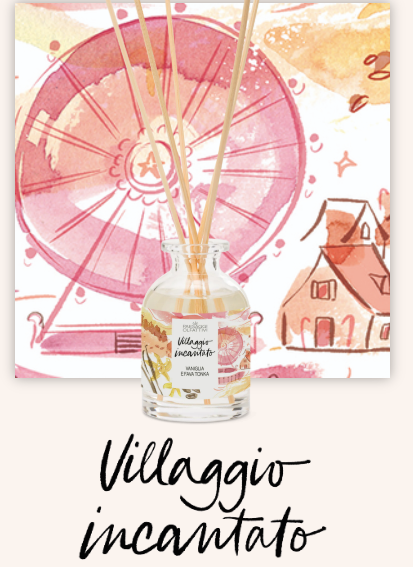 primo piano del profumatore d'ambiente villaggio incantato di domea (linea paesaggi olfattivi). lo sfondo è sul rosa,ricorda i bei tramonti.rappresenta un villaggio con una ruota panoramica sullo sfondo